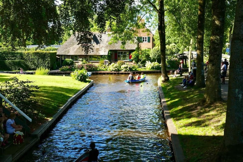 1 Hour Private open boat tour with local captain - The first canal miles: bridges and thatched homes