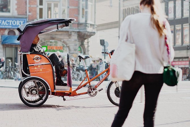2 hours Amsterdam City Tour in Pedicab - Dam Square, canals, and the city’s postcard views