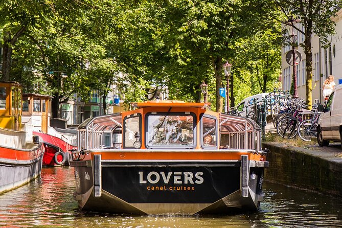 Amsterdam 1h Canal Cruise by Semi-Open Boat with Audio Guide - From the Red Light District to Munt Tower