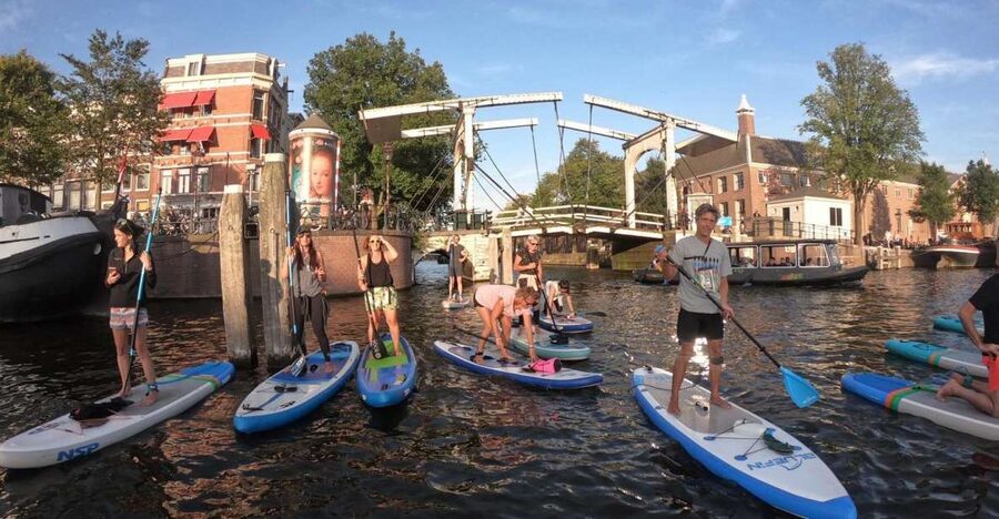 Amsterdam: 2-Hour Stand Up Paddle Board Tour - Learning to balance on the quiet canal
