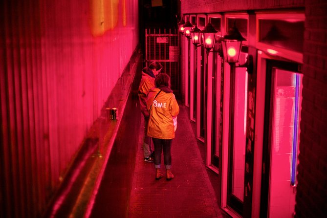 Amsterdam After Dark: Public Red Light District Exploration - The Oude Kerk puts the district in perspective
