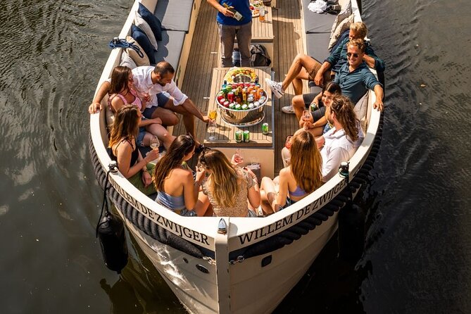 Amsterdam: Canal Booze Cruise with Unlimited Drinks Option - A one-hour introduction to Amsterdam from the water