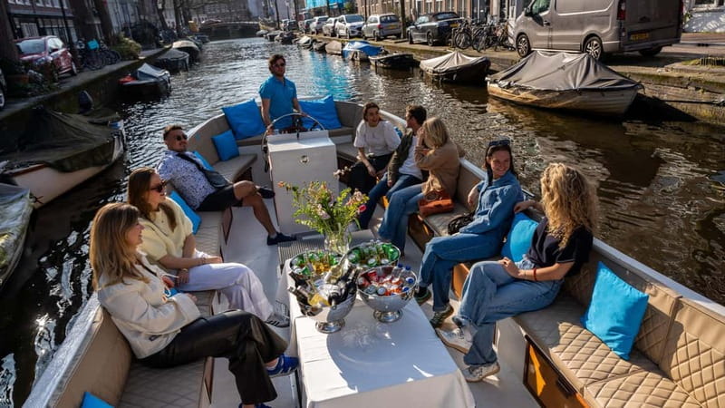 Amsterdam: Canal Cruise in Open Boat with Drink Option - Royal Theater Carré and the Magere Brug