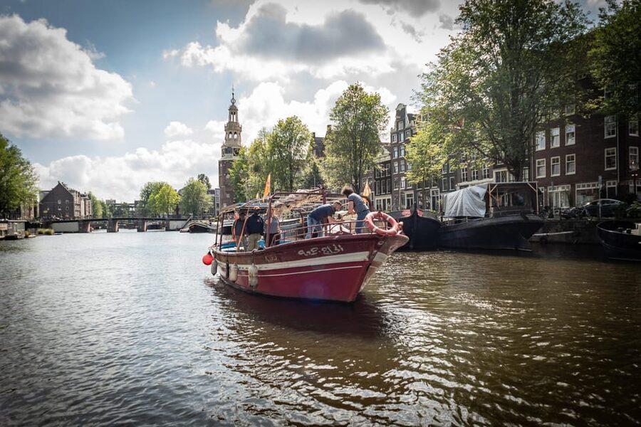 Amsterdam: Canal Cruise on a Wooden Refugee Boat - Weather planning for an open wooden boat