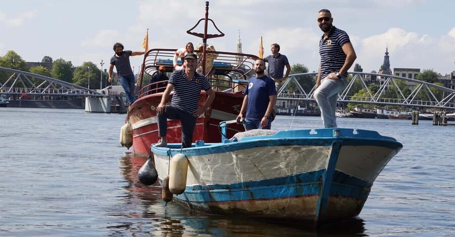 Amsterdam: Canal Cruise on a Wooden Refugee Boat - Finding the harbor at Mediamatic
