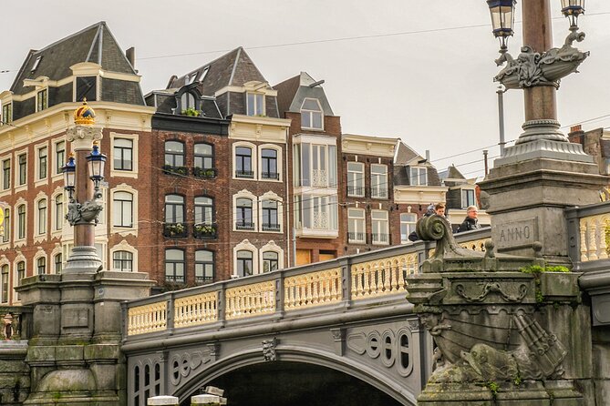 Amsterdam Canal Cruise with German Guide and unlimited drinks - Jewish Amsterdam and the city’s layered past