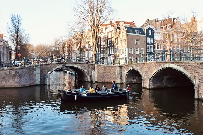 Amsterdam Canal Tour by Open Boat – 90 min Small Group Experience - The Amsterdam ship and modern waterfront architecture