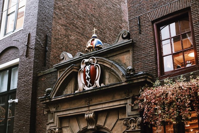 Amsterdam City Center & History - Exclusive Guided Walking Tour - Grand houses, tiny houses, and the Dutch East India Company