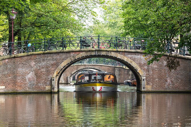 Amsterdam City Centre Cruise on heated boat with Audioguide - Audio commentary, captains, and the onboard atmosphere