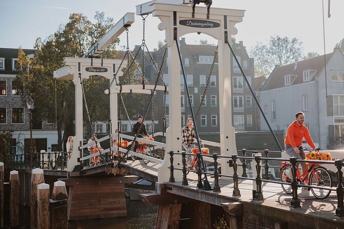 Amsterdam City Top Highlights Guided Bike Tour - What the Guides Add