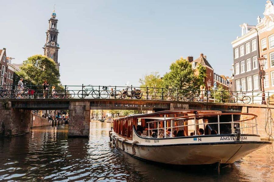 Amsterdam: Classic Boat Cruise with Optional Cheese & Wine - What the guides add to a one-hour ride