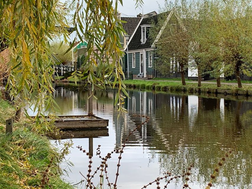 Amsterdam: Countryside Bike Tour and Zaanse Schans Windmills - Industrial windmills beyond the postcard view