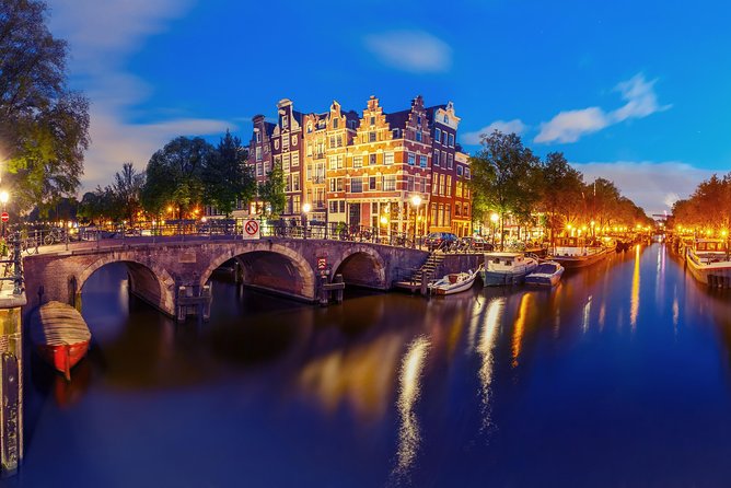 Amsterdam Evening Canal Cruise with Live Guide and Onboard Bar - The canal ring, bridges, and the rare long view