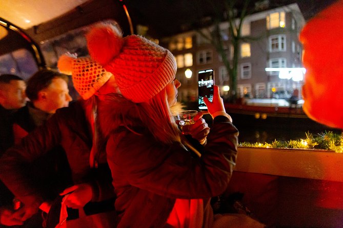 Amsterdam Evening Canal Cruise with Live Guide and Onboard Bar - Magere Brug and the evening lights