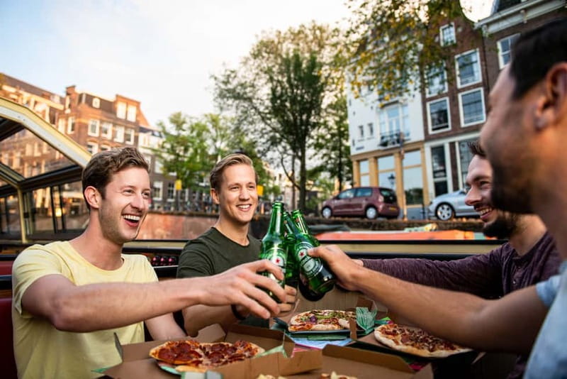 Amsterdam: Evening Pizza Cruise Along the Canals - Warm boat, small snacks, and the pizza choice