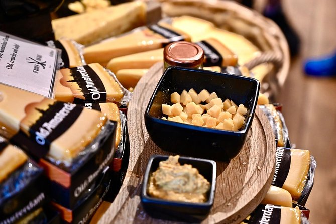 Amsterdam Food Tour of 10+ Local Classic Tastings in Jordaan Area - A fishmonger brings herring and kibbeling