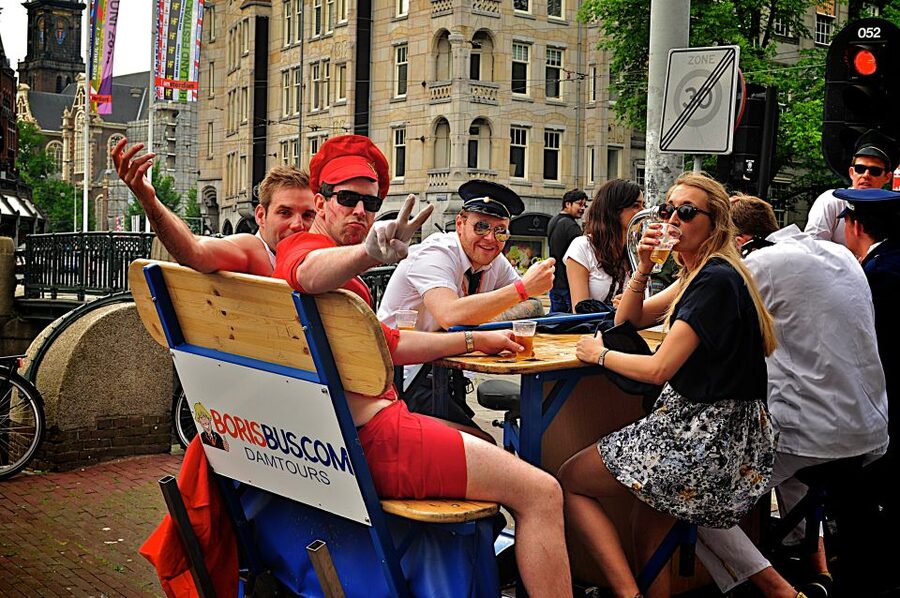 Amsterdam: Guided Beer or Prosecco Bike Tour - Pedaling through Amsterdam on an assigned route