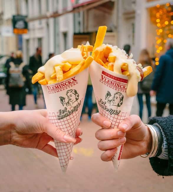 Amsterdam: Guided Cultural Food Tour in German or English - Canal-belt streets and Amsterdam’s crooked houses
