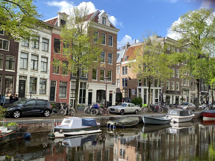Amsterdam: Guided Off-The-Beaten-Track Walking Tour - Dam Square, the palace, and Amsterdam’s public face