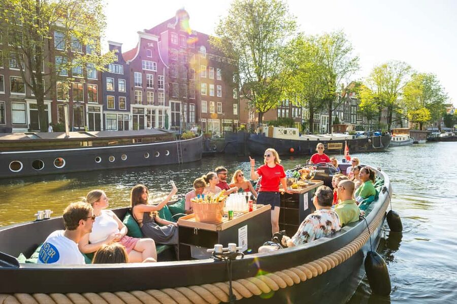 Amsterdam: Guided Open Boat Canal Cruise Including Drink - Quick points before you book