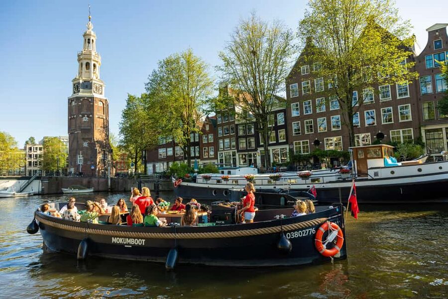 Amsterdam: Guided Open Boat Canal Cruise Including Drink - The western canals and Anne Frank House