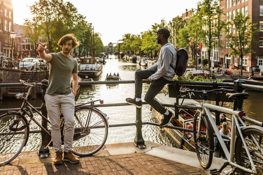 Amsterdam: Highlights & Hidden Gems Private Walking Tour - Canal banks and the Bloemenmarkt