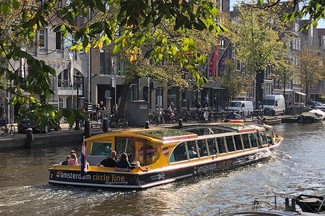 Amsterdam: Historic City Sightseeing Canal Cruise - Centraal Station and the wide waters of the IJ