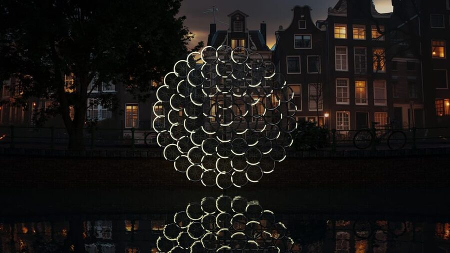 Amsterdam: Light Festival Boat Tour with Warm Drinks - Amsterdam’s canals turn into a winter art route