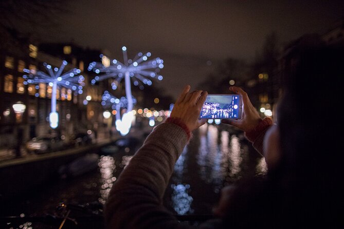 Amsterdam Light Festival: Canal Cruise + Bite & Unlimited Drinks - Seeing the Light Festival from the canals