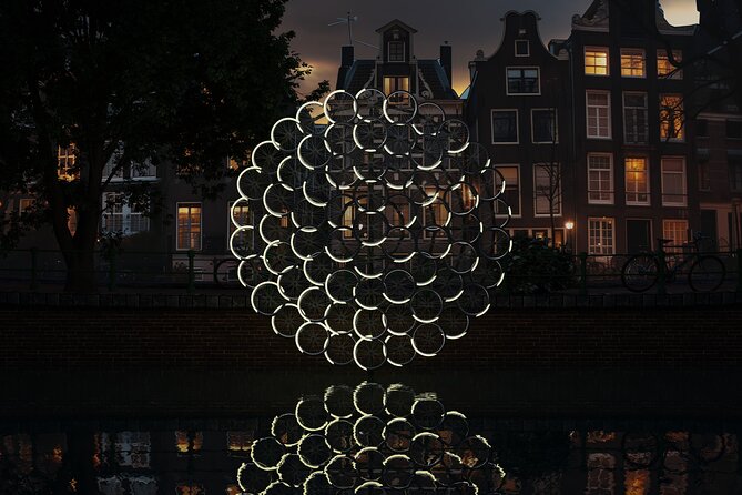 Amsterdam: Light Festival Open Boat - Unl. Drinks Option - Montelbaanstoren, the tower with a strange clock