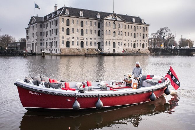 Amsterdam Light Festival: Saloon Boat Cruise + Hot Drinks & Bite - Live guides, local stories, and the sound problem