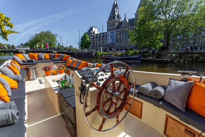 Amsterdam Light Festival: Saloon Boat Cruise + Hot Drinks & Bite - Starting near the National Maritime Museum