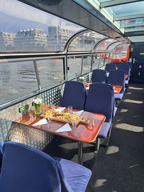 Amsterdam: Luxury Cheese & Wine Canal Cruise - Boarding a traditional Dutch boat