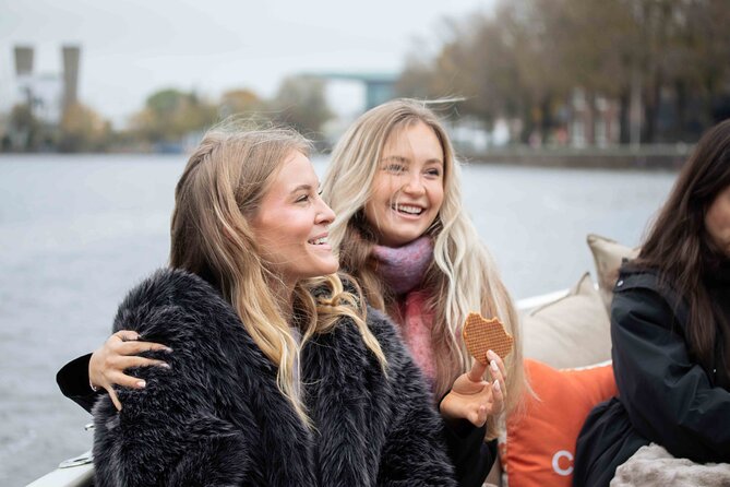 Amsterdam: Luxury Saloon Boat Cruise with Cocktails & Waffle - Locks, Central Station, and the old harbor