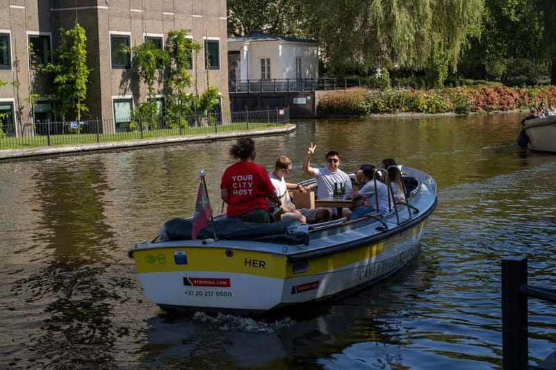 Amsterdam: Open Boat Tour of Canals with Expert Local Guide - Booking and timing tips