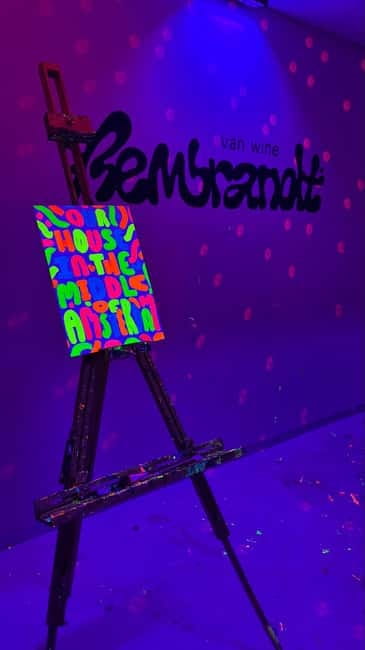 Amsterdam: Paint and Sip in the Dark at Rembrandt van Wine - Getting Set Up With Canvas, Apron, and Paint
