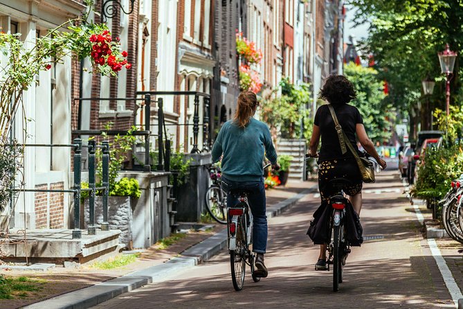 Amsterdam PRIVATE Bike Tour With Locals: Bike & Local Snack Included - The Jordaan: canals, markets, and local rhythm