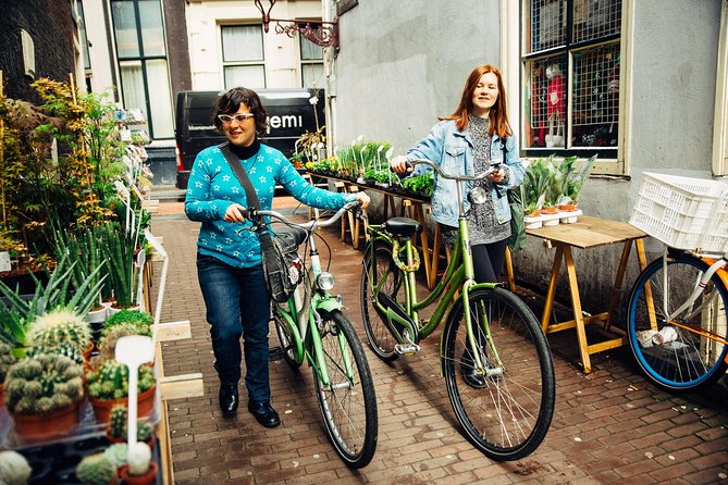 Amsterdam PRIVATE Bike Tour With Locals: Bike & Local Snack Included - A quieter ride north through villages