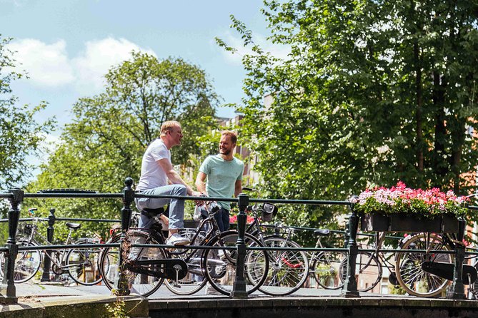 Amsterdam PRIVATE Bike Tour With Locals: Bike & Local Snack Included - Starting near Centraal Station