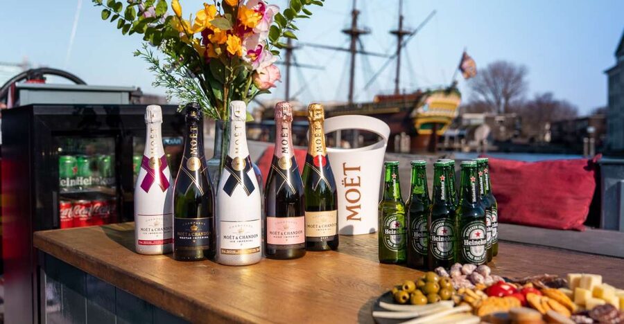Amsterdam: Private Canal Cruise with Drinks and Snacks - The first stretch through Amsterdam’s famous canals