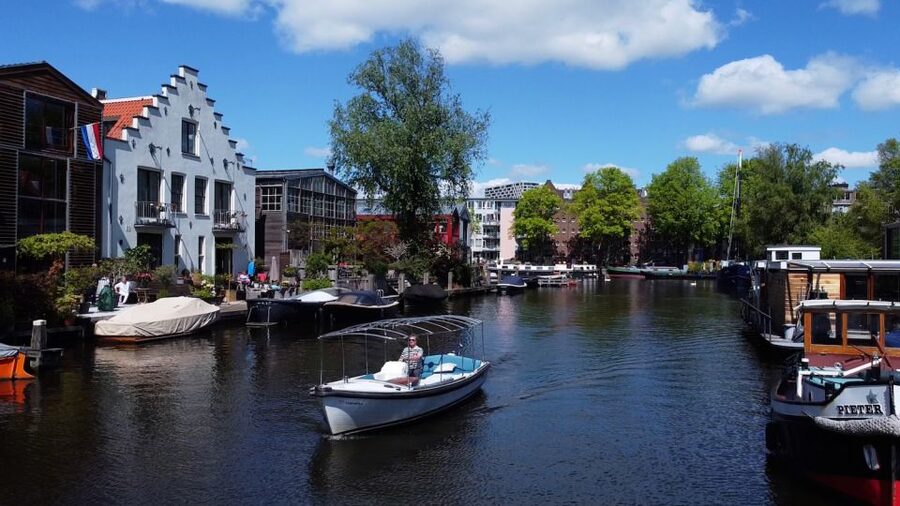 Amsterdam: Private Canal Tour - Boarding beneath the light blue roof