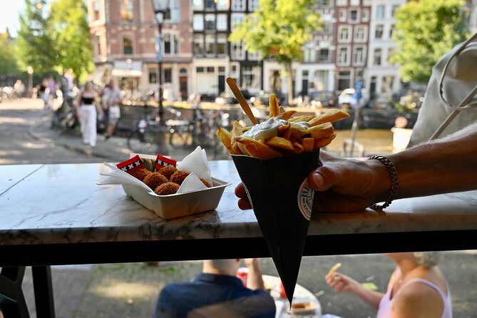 Amsterdam Private Food & Drinks Tour by UNESCO Canals & Jordaan - Singel and the flower stalls