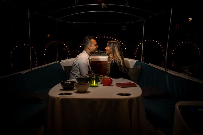Amsterdam: Private Romantic Evening Canal Cruise + Bubbles/Snacks - The Skinny Bridge under hundreds of lights