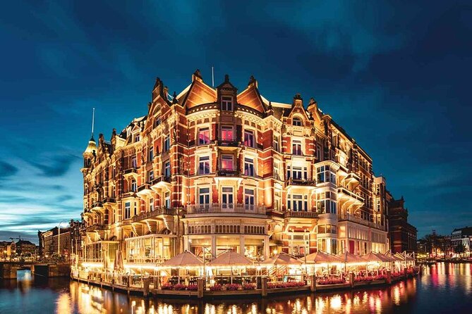Amsterdam: Private Romantic Evening Canal Cruise + Bubbles/Snacks - Torensluis, houseboats, and the city after dark