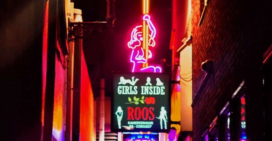 Amsterdam: Red Light District and Coffeeshop Culture Tour - Entering the Red Light District through its famous sights