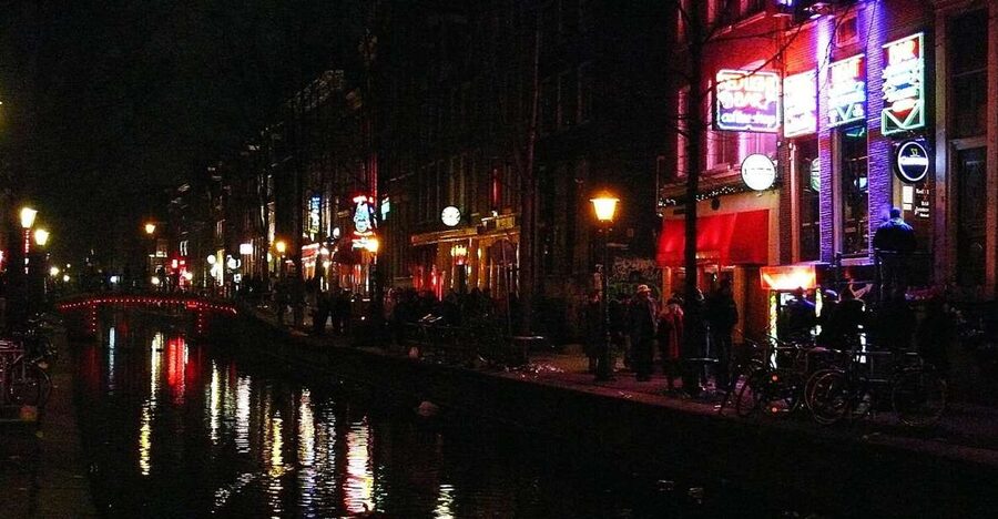 Amsterdam: Red Light District and Coffeeshop tour - The red windows and the people behind them