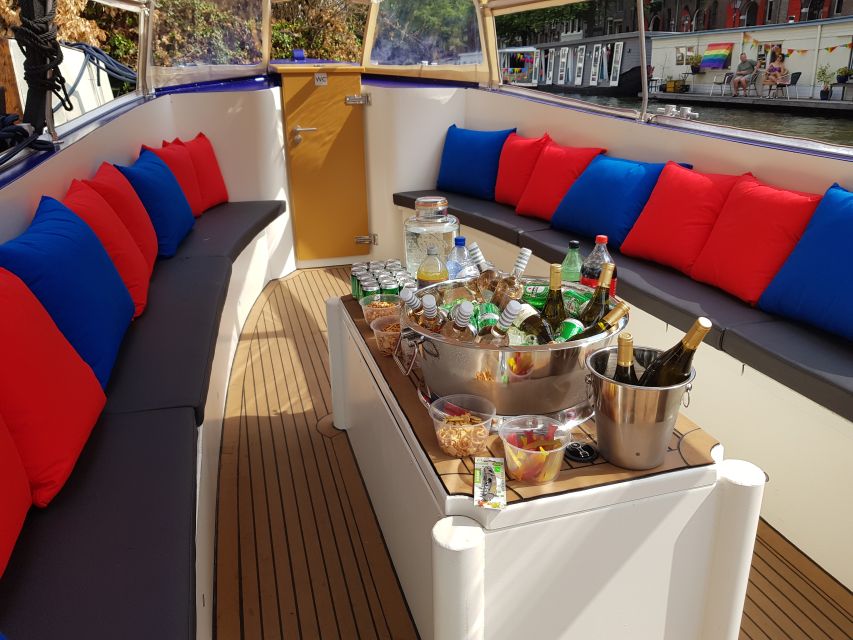 Amsterdam: Red-Light District Pub Crawl and Booze Boat Tour - A canal cruise with a party already in motion