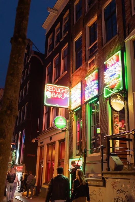 Amsterdam: Red Light Tour Exclusive + Peep Show - Starting beneath the National Monument at Dam Square