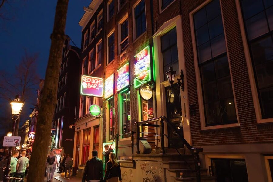 Amsterdam: Red Light Tour Exclusive + Peep Show - Warmoesstraat and Amsterdam’s narrowest alley