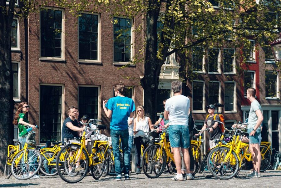 Amsterdam: Relaxed City Highlights Guided Bike Tour - Leidseplein, music, and city nightlife
